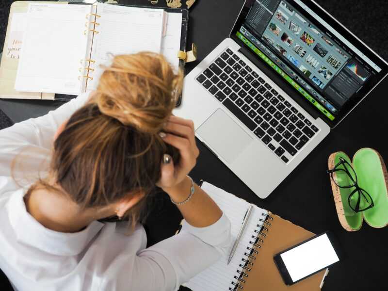 4 Mental Health Hacks Remote WordPress Professionals Can Start Right Now! 2 woman stressed out working computer