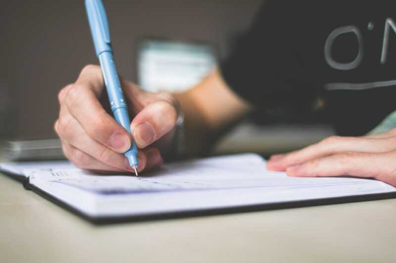 4 Mental Health Hacks Remote WordPress Professionals Can Start Right Now! 6 person writing in a journal